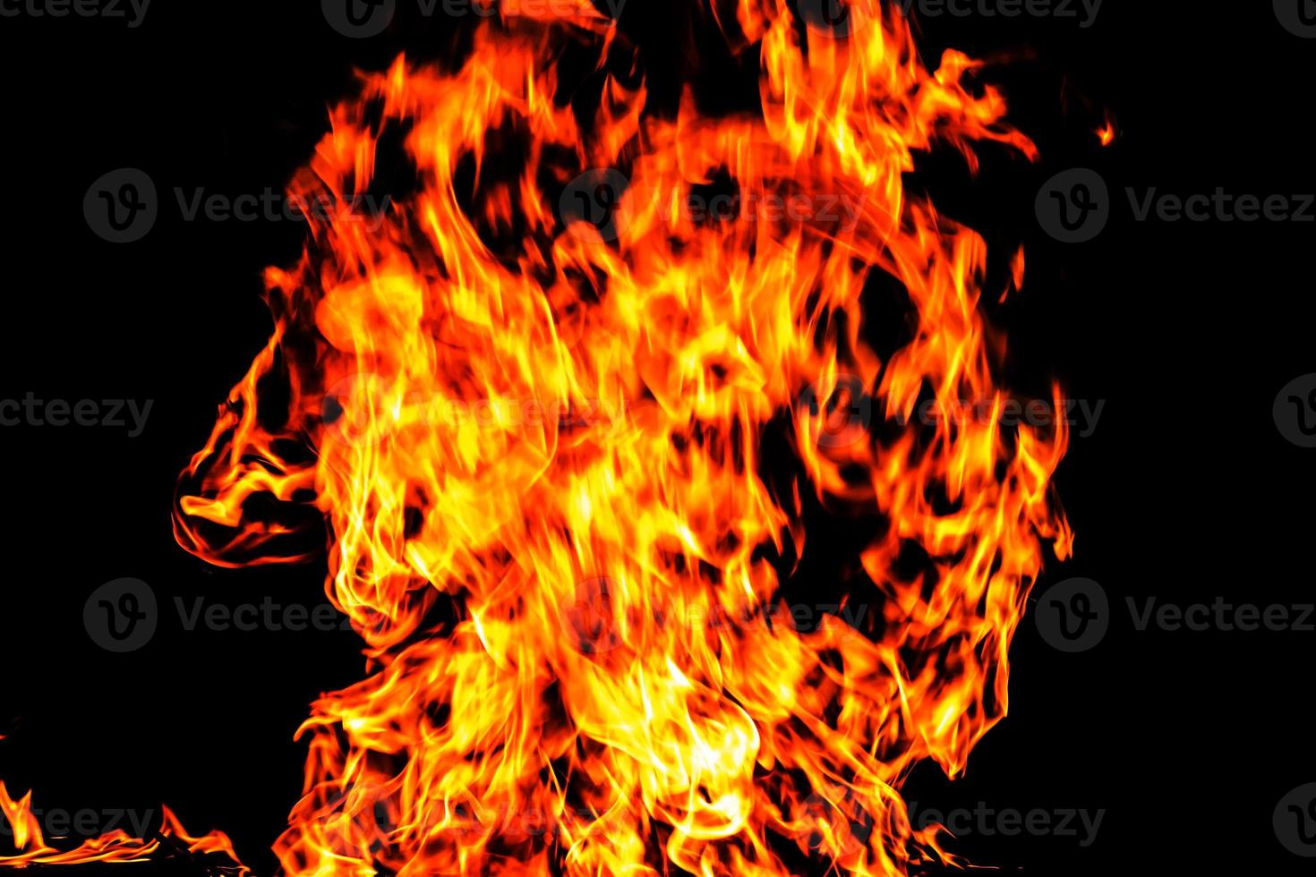 Fire flame texture. Burning material backdrop. Burn effect pattern. Blaze and torch wallpaper. Heat and haze backdrop. photo