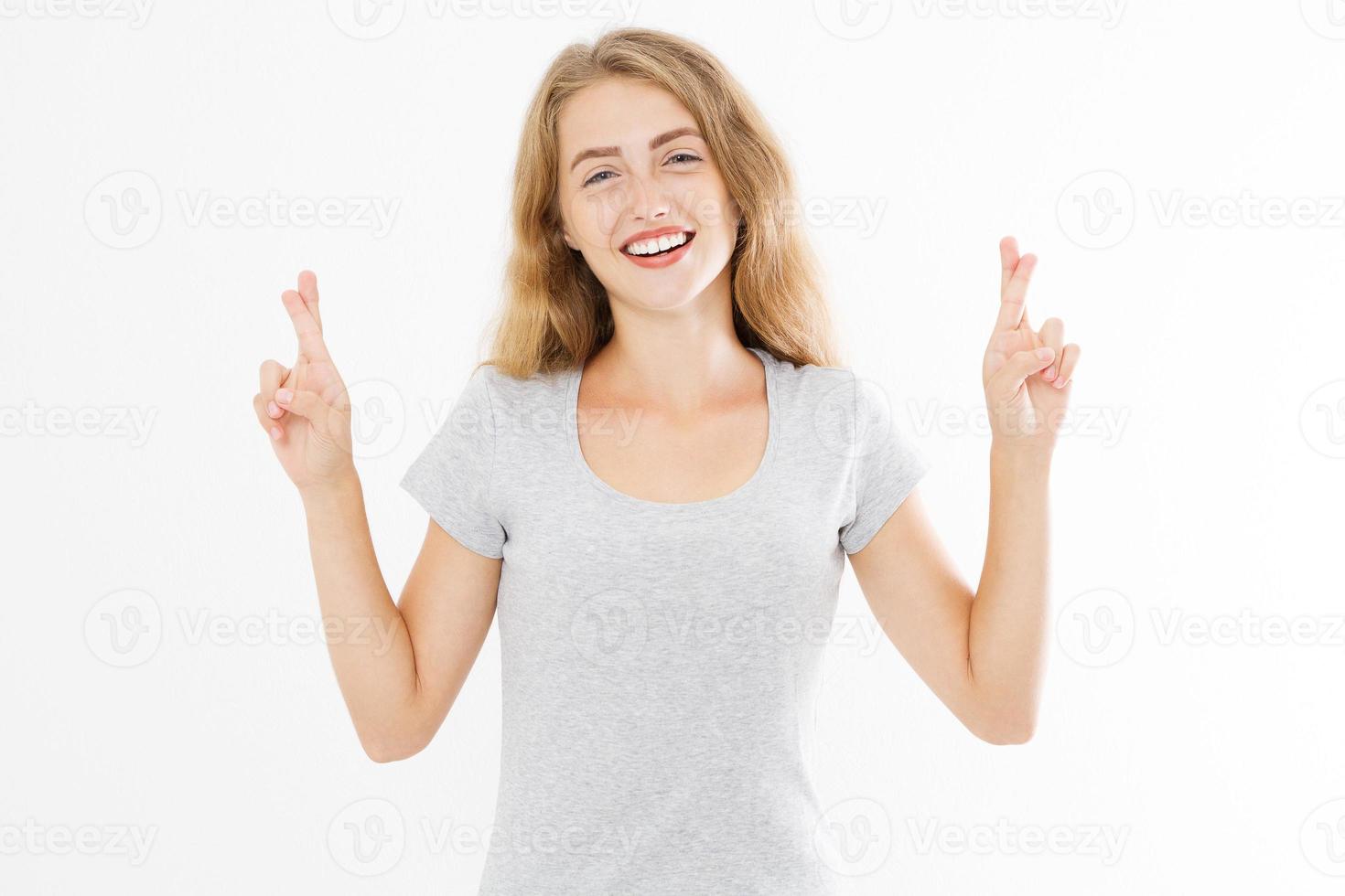 Cross fingers and good luck sign on body language. Happy woman in template blank summer t shirt. Girl with healthy lifestyle and mental health isolated on white background. Copy space photo