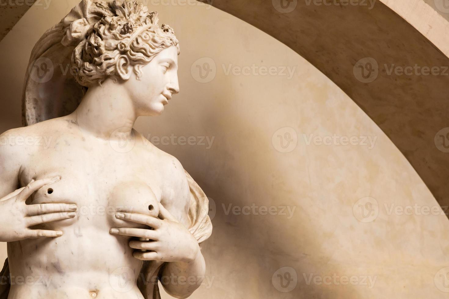 Sensual naked woman statue in Florence, Italy. Beauty figure made of stone. photo