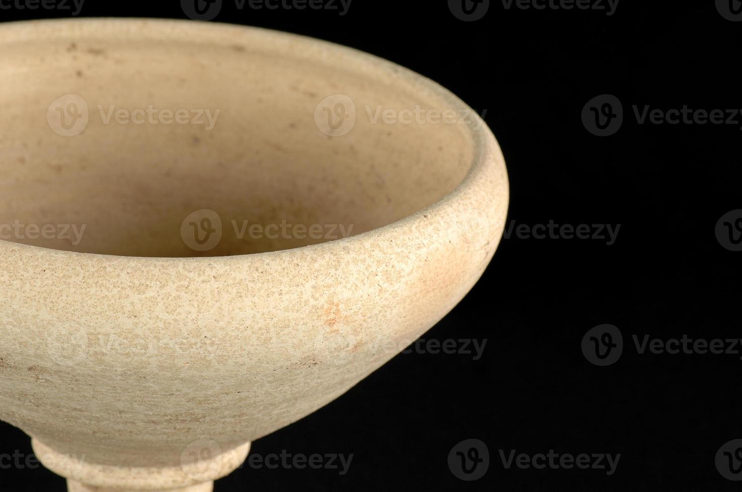 A clay vase isolated on a white background photo