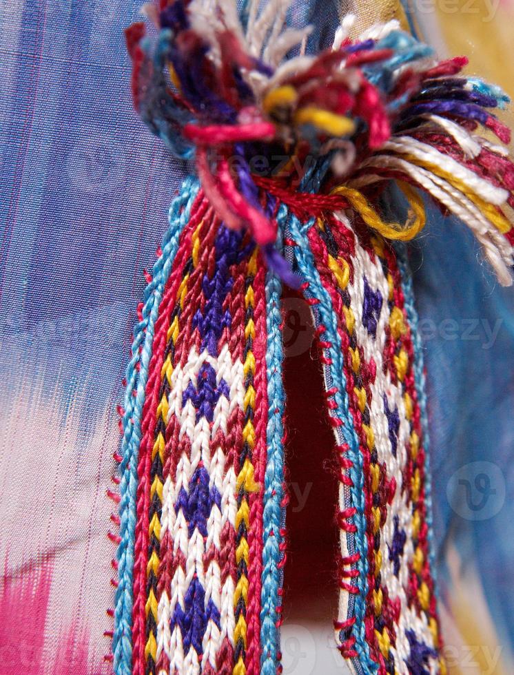 The decorative elements and ornaments on the national clothes of Uzbekistan photo