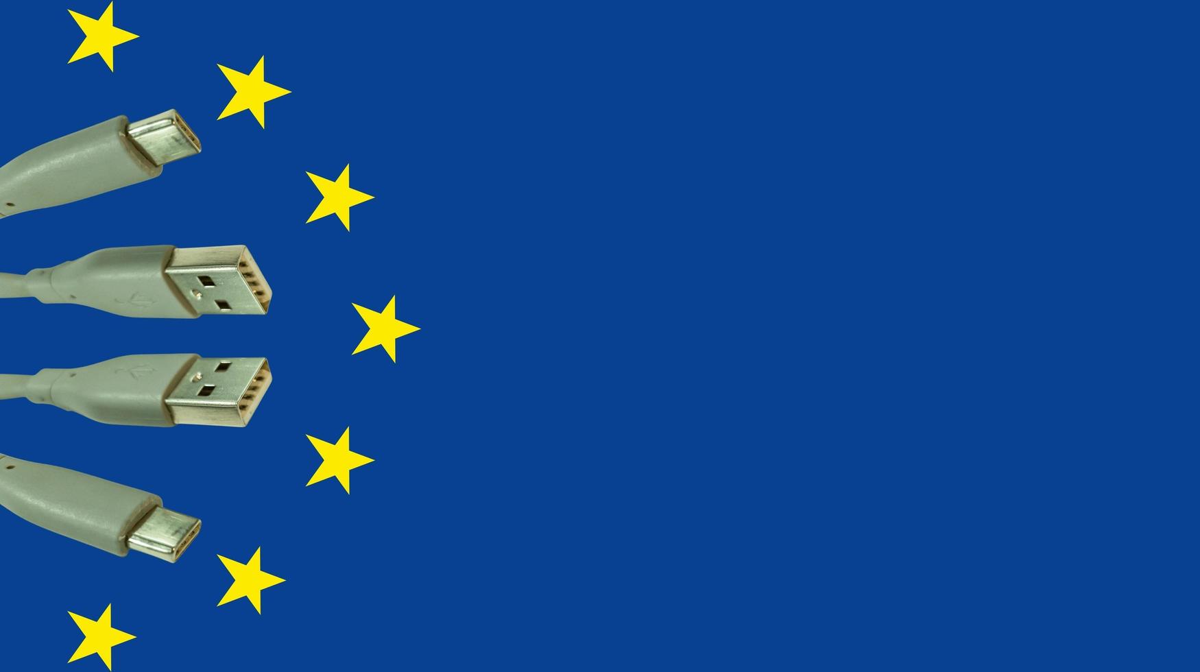 illustration Concept of European Union law to force USB-C charger for all mobile phones. EU flag and USBC universal charging cable. Selective focus. photo