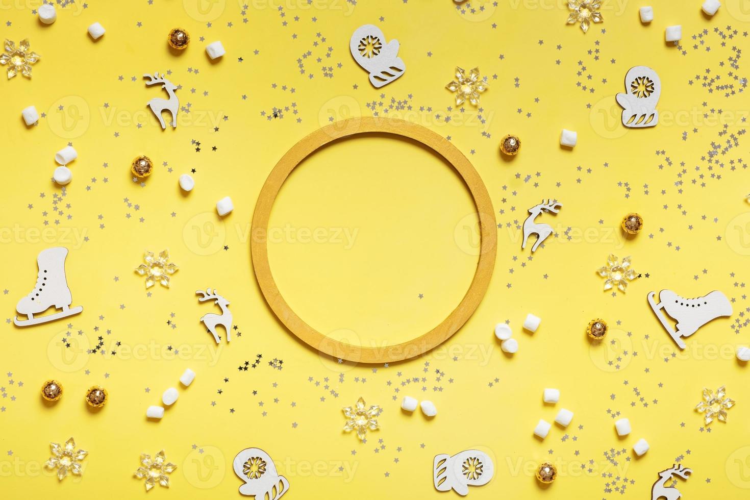 Christmas background made from round frame and festive decorations top view. Christmas flat lay photo