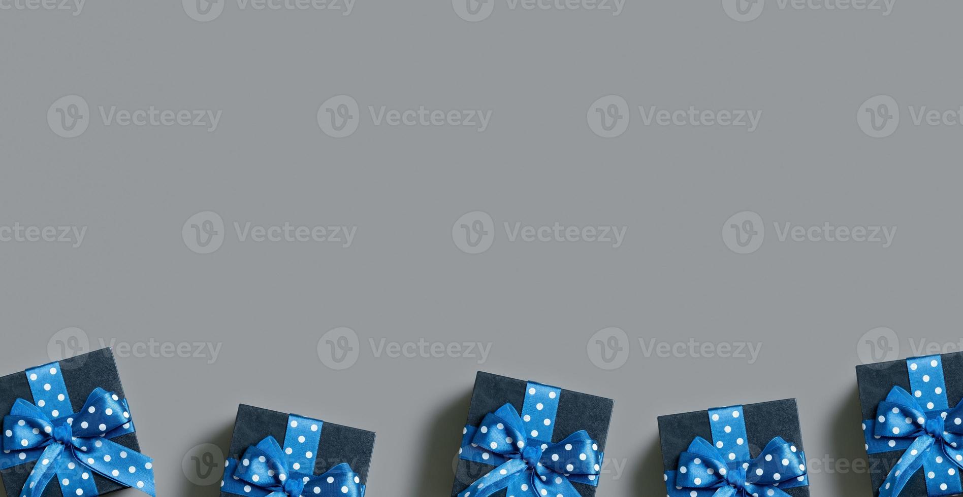 Banner with Black gift boxes with bow flat lay on grey background. View from above. Copy space photo