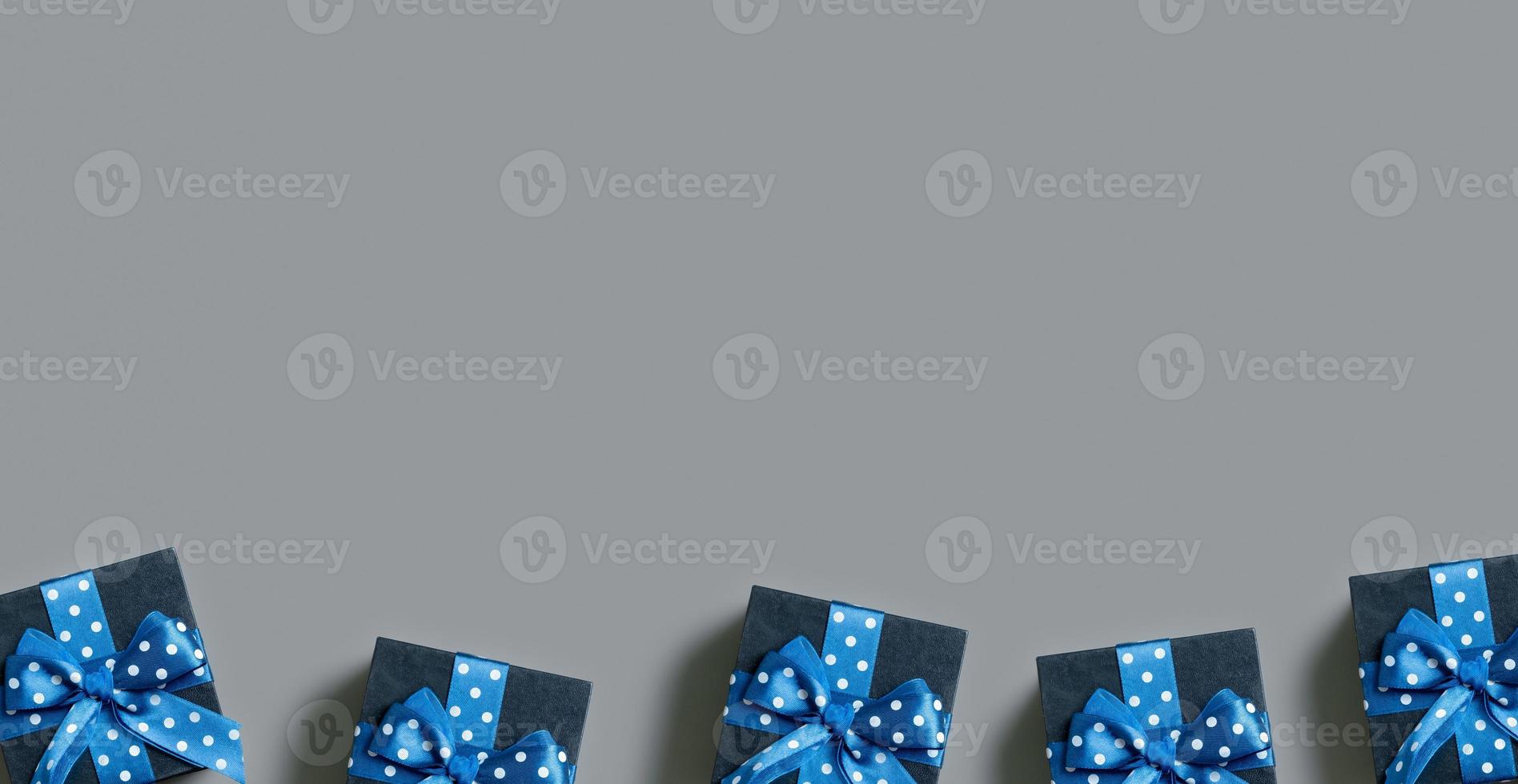 Banner with Black gift boxes with bow flat lay on grey background. View from above. Copy space photo