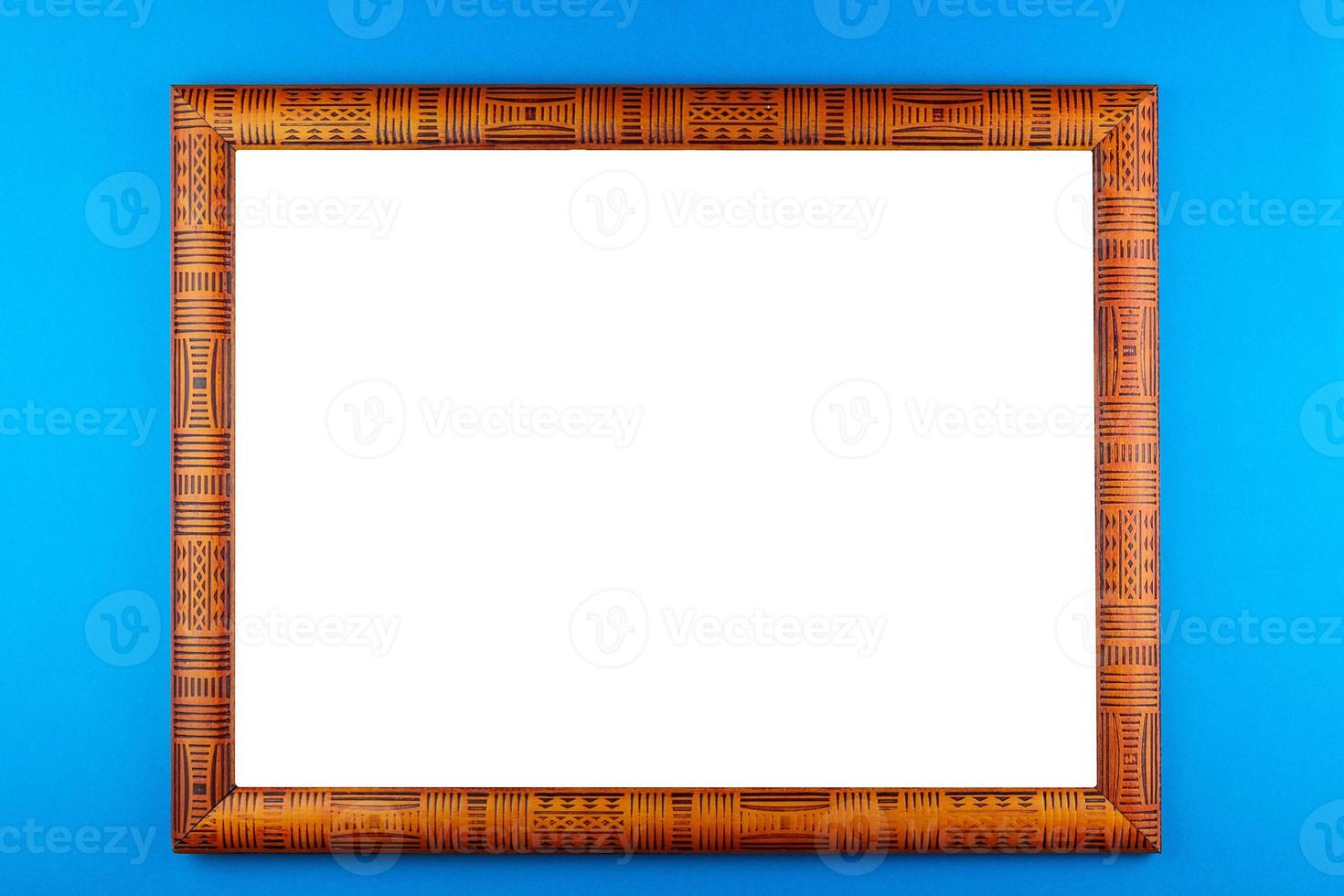 Wooden frame blue background photo