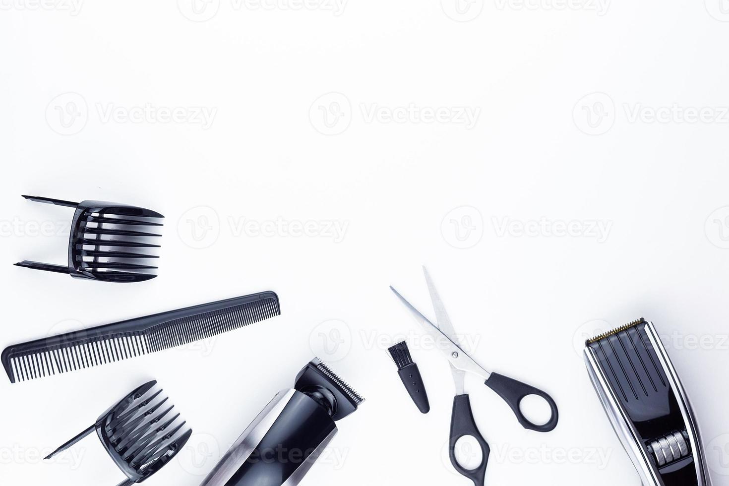 scissors and combs on white photo