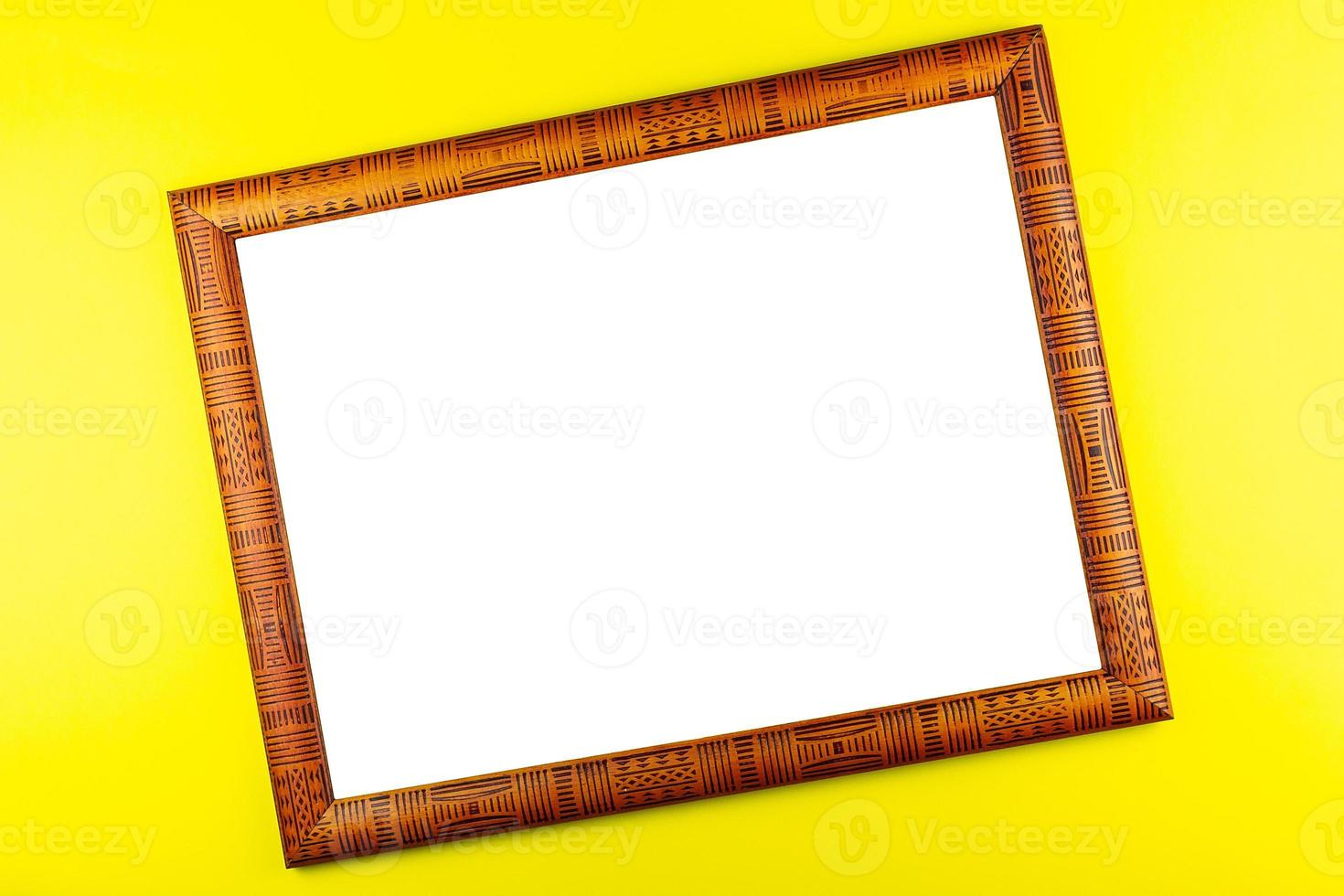 Wooden frame yellow background photo