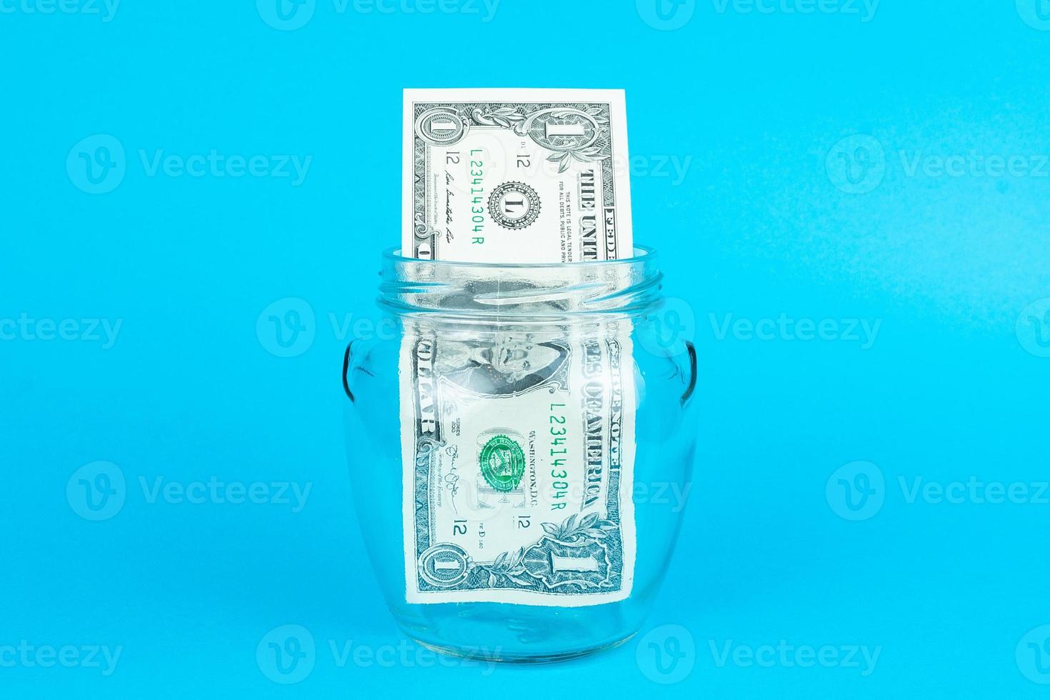 Dollar in a glass jar photo