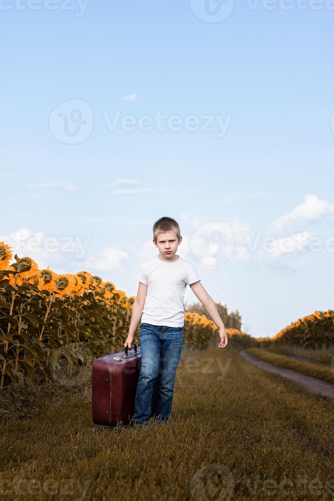 the boy in the suitcase 13465045 Stock Photo at Vecteezy