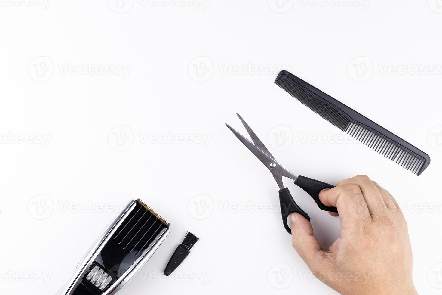 scissors and combs on white photo
