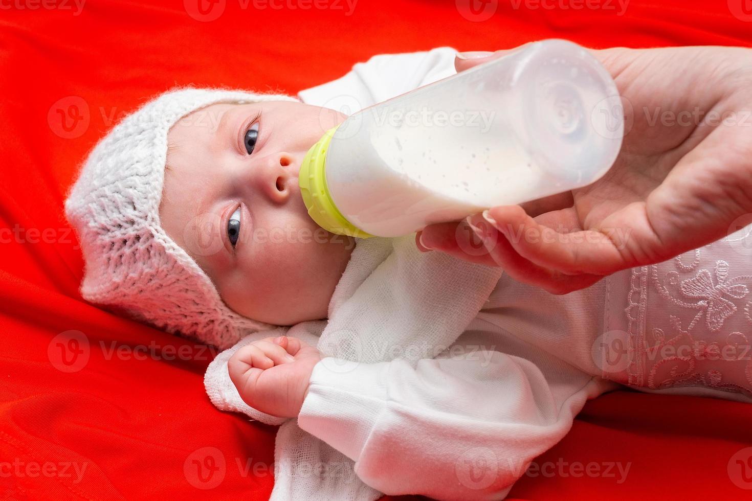 feeding baby from the bottle photo
