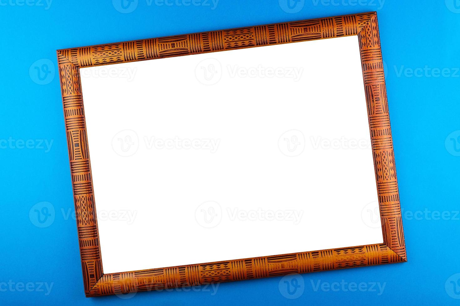 Wooden frame blue background photo