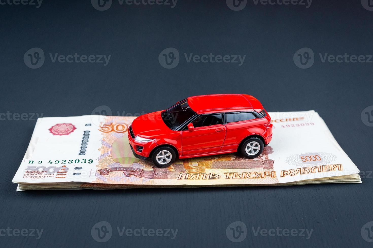 Toy car on money photo