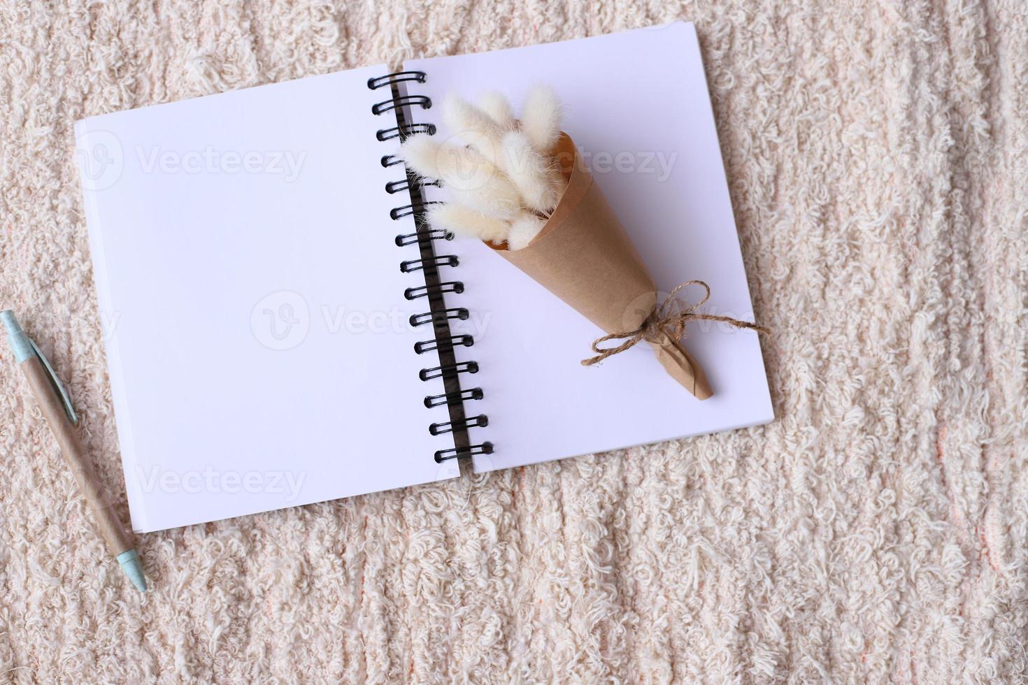 Blank notebook with dried flower photo