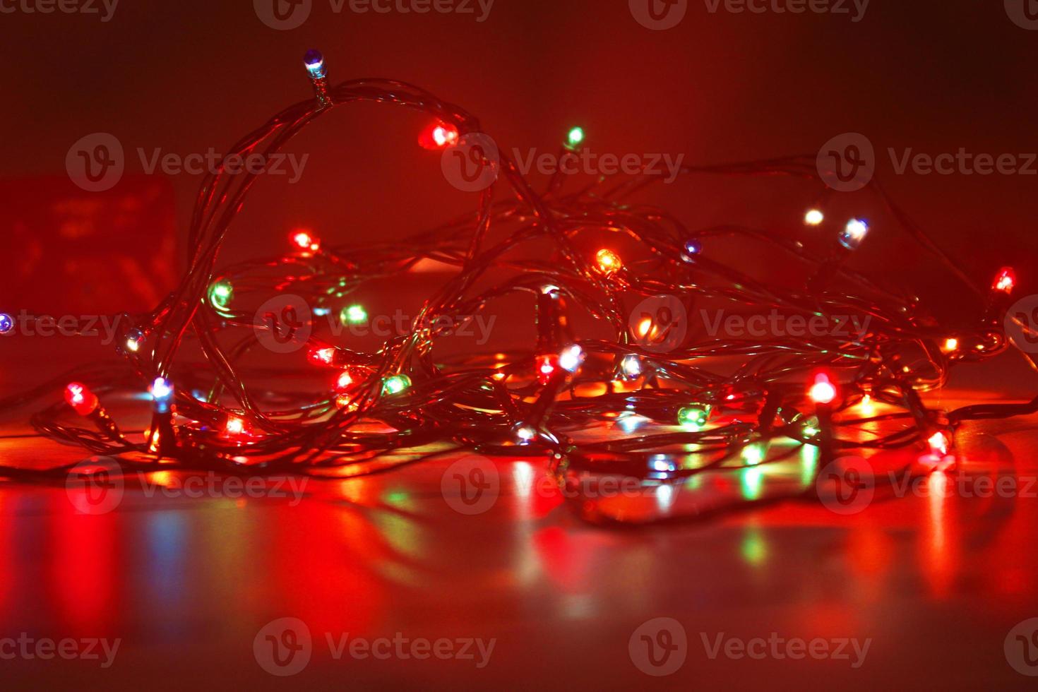 Christmas garland on a dark background. Concept of christmas, new year. Blurred background, out of focus. photo