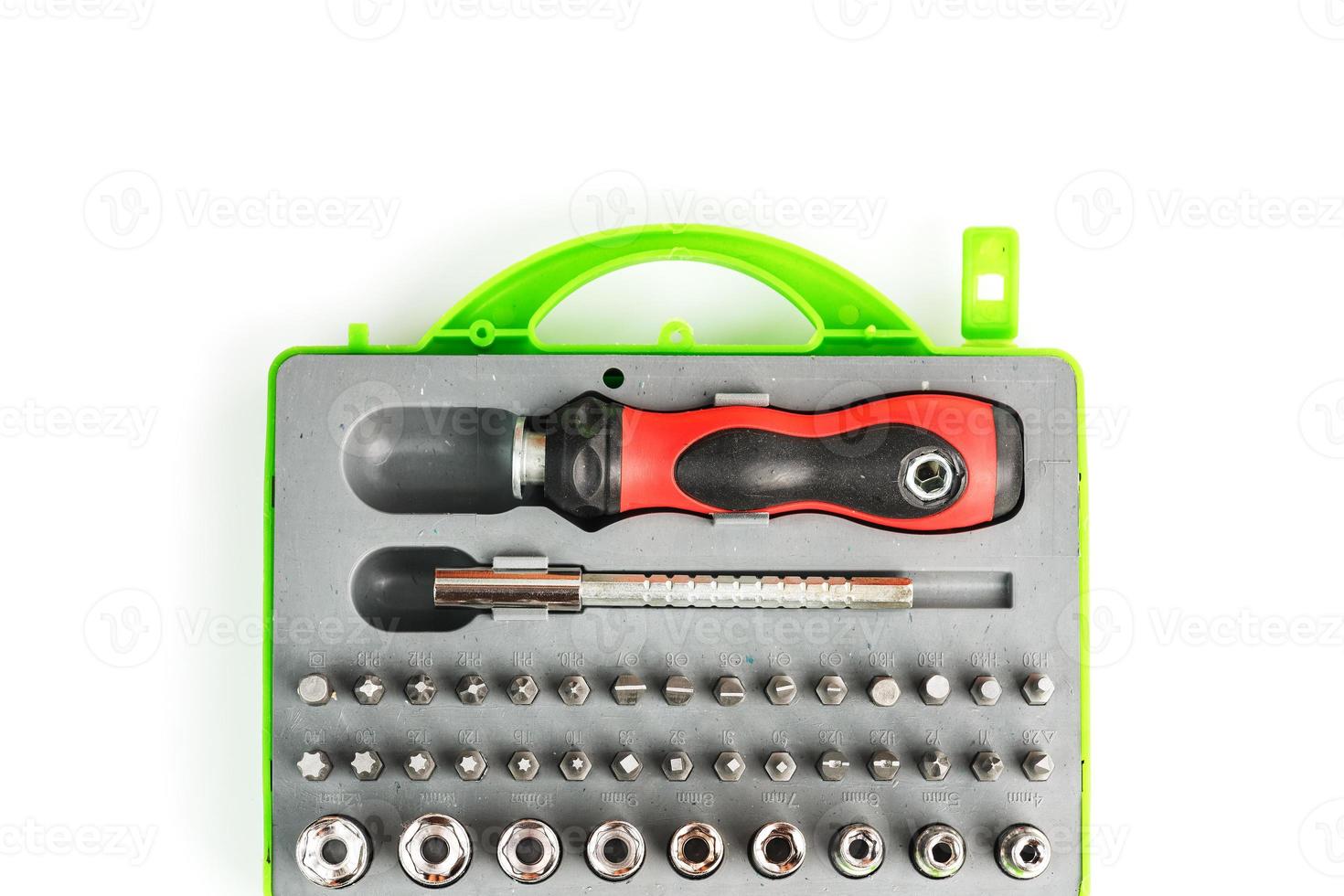 Tool box with attachments and bits of different shapes and sizes. Isolate, free space. photo