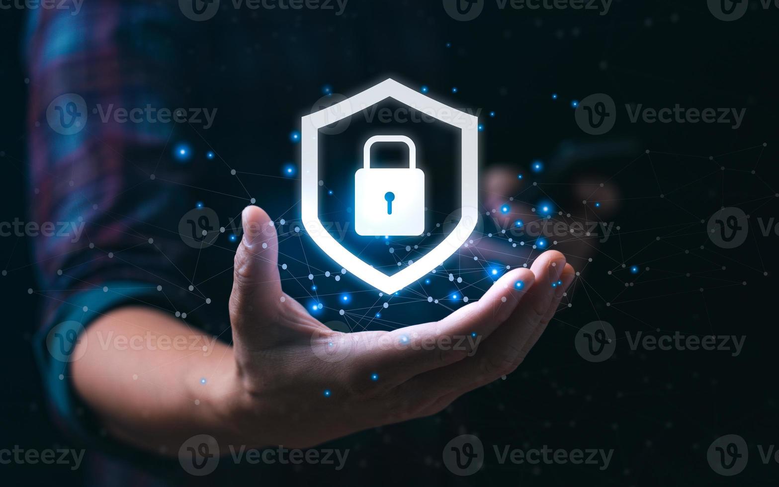 internet security concept and cyber networks. man holding shield icon virtual with lock symbol with network security photo