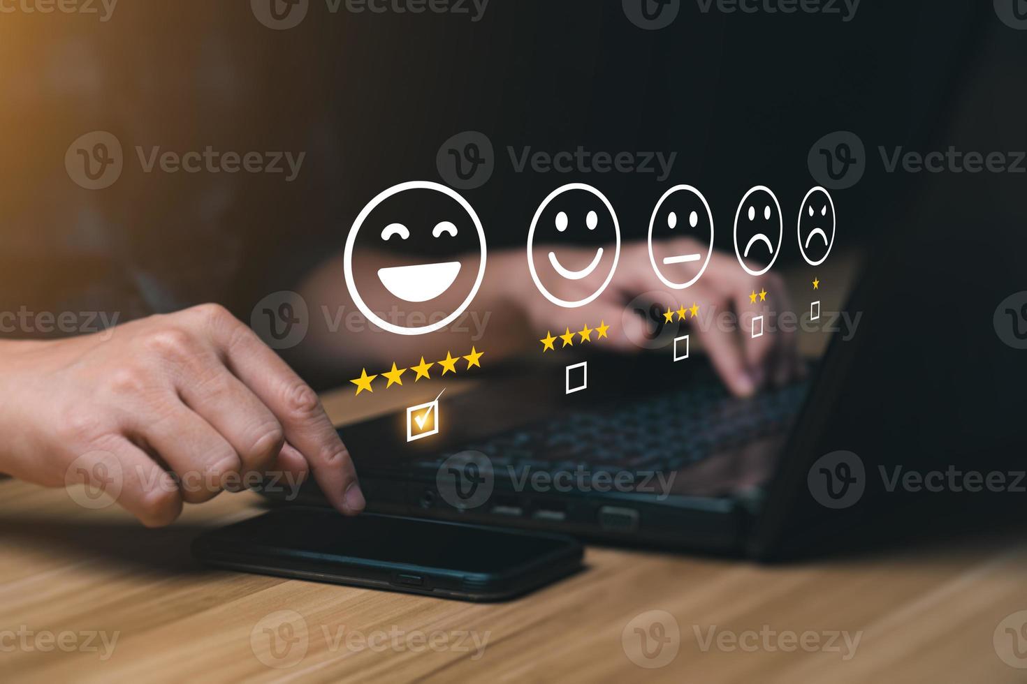 Customer satisfaction concept. Hands of a business man using a smartphone to comment 5 stars. with copy space. 5 star satisfaction, Excellent business rating experience photo