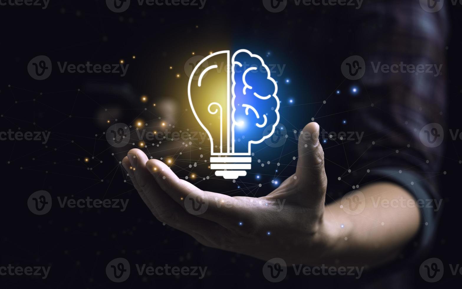 Smart thinking idea and inspiration innovation concept. businessman holding half brain icon and light bulb. Solve problems intelligently photo