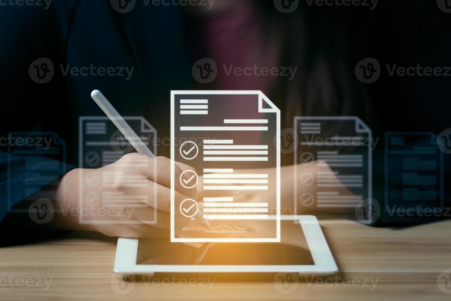 businessman uses a pen to sign electronic documents on digital documents on a virtual screen. electronic signature Technology and Document Management. Check the correct information or product list. photo