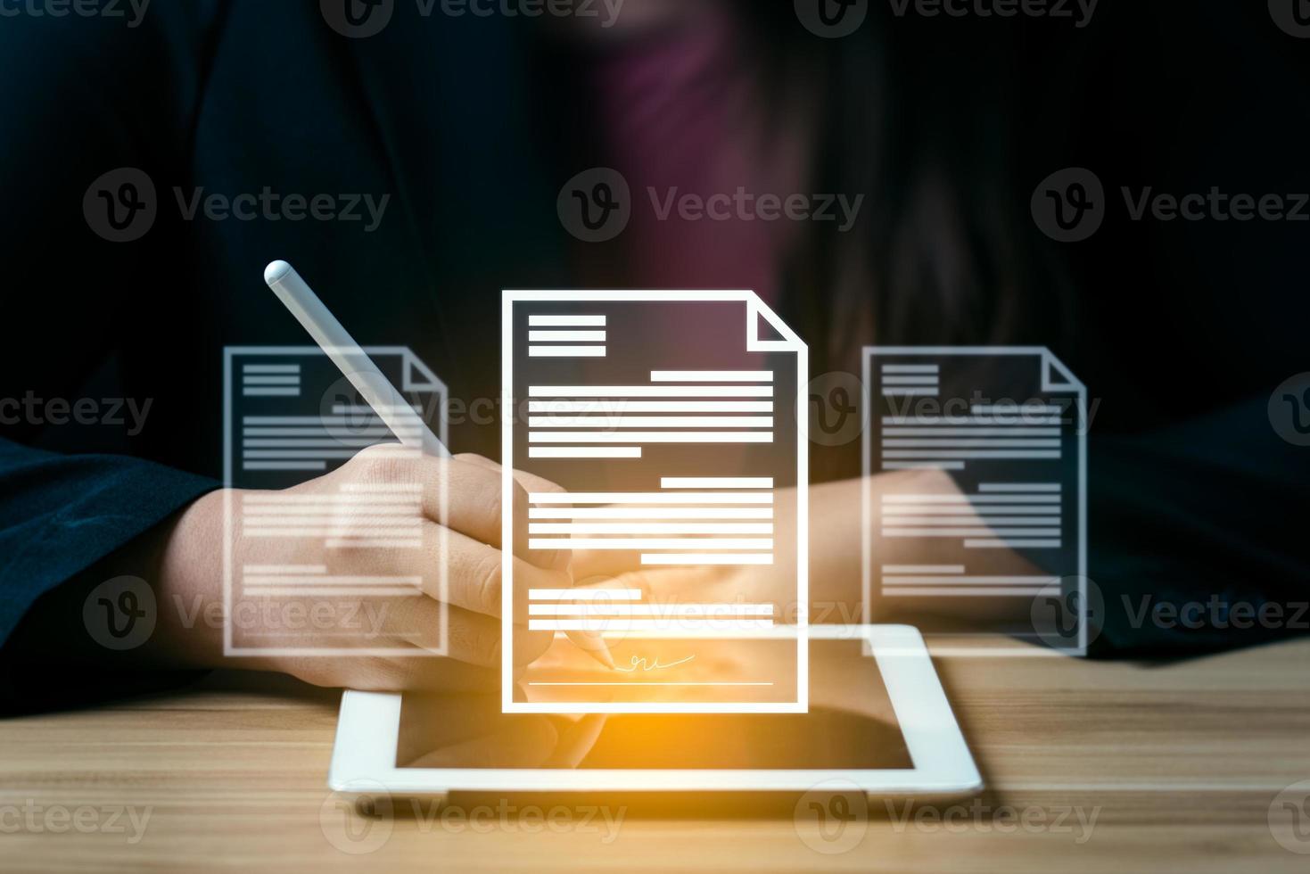 business woman uses a pen to sign electronic documents on digital documents on a virtual screen. electronic signature, Technology and document management photo