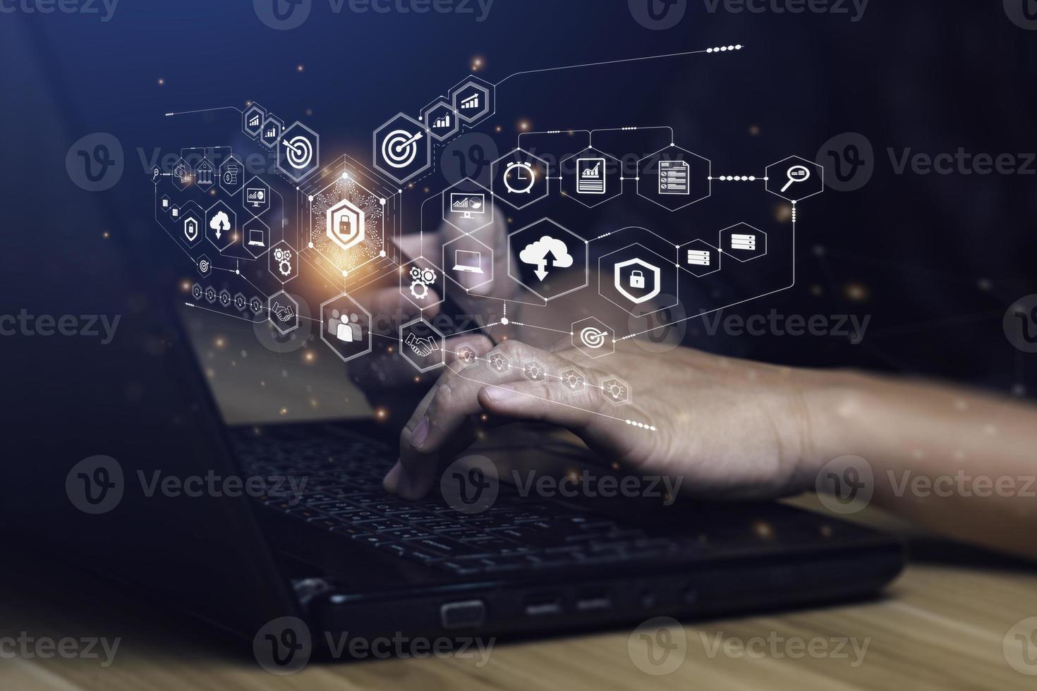 Internet Security and Cyber Network Concepts. Businessman working with laptop computer with padlock icon. data protection and personal information. Hackers' digital crimes photo