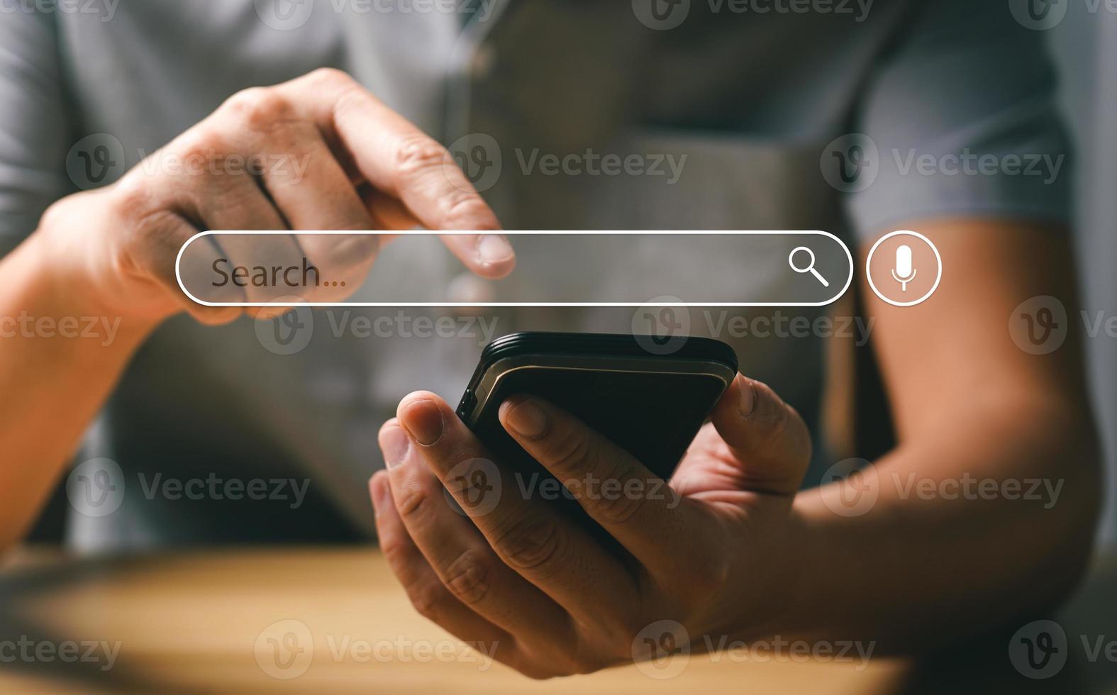 Search Engine Concept. Tools or programs for searching for information on the Internet. Men's hands use their mobile phones to information using search engines and help grow their online business. photo