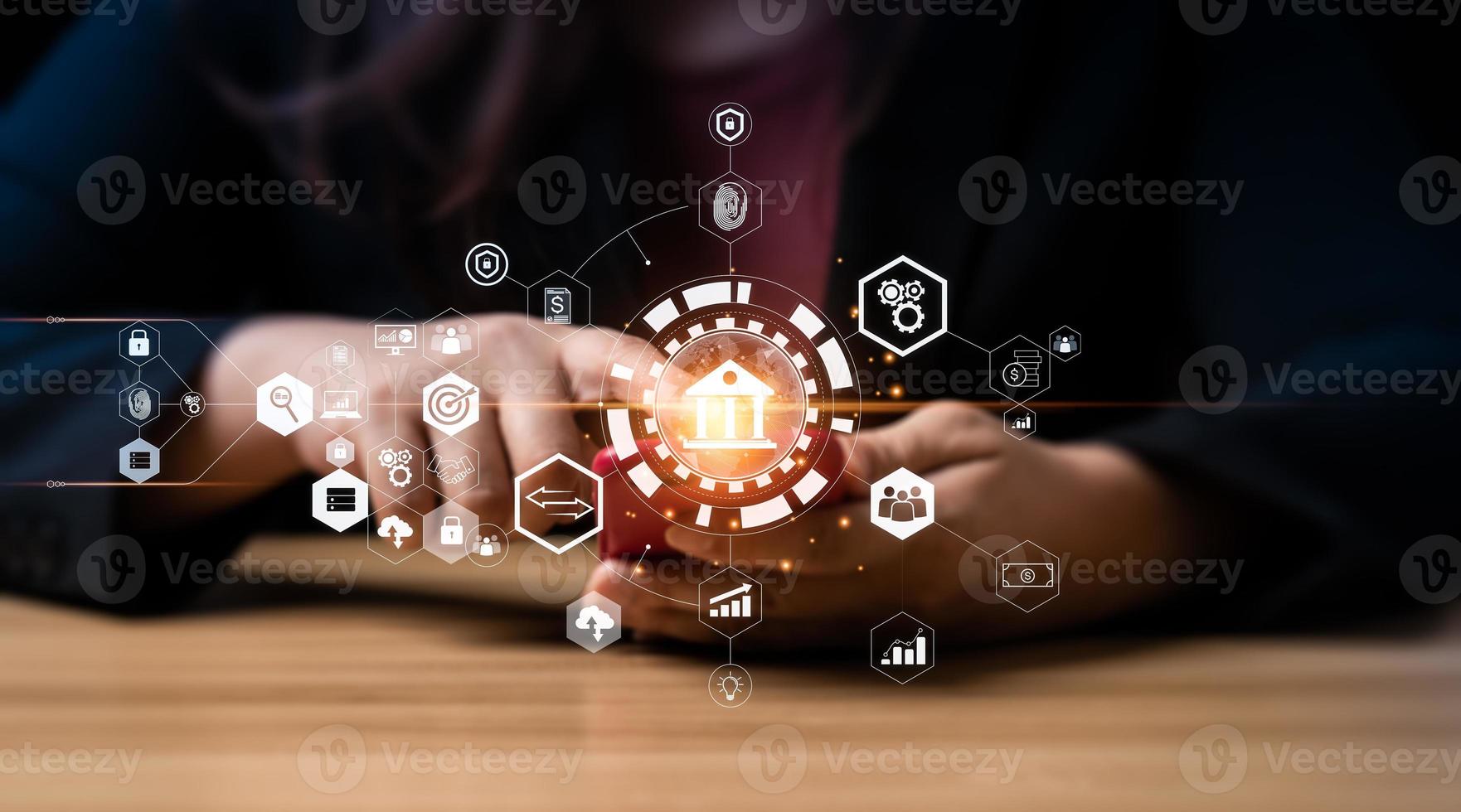 Businessman using mobile online banking and taps a bank icon to connect to a networking. Finance and banking networking. Digital marketing. cyber security. business technology. exchange photo