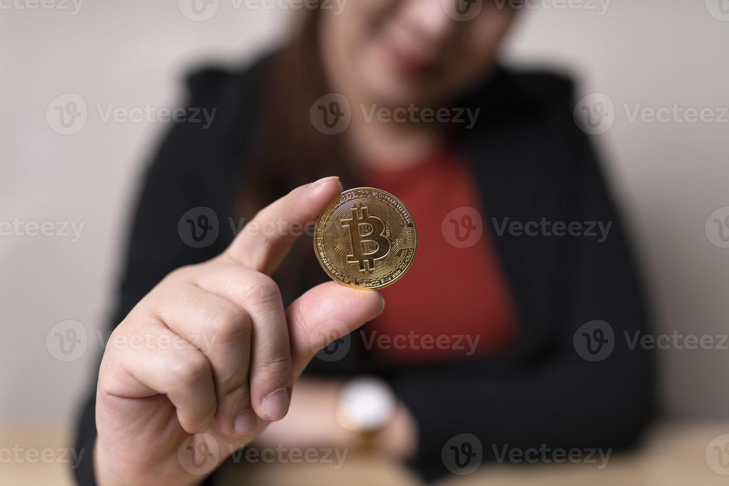 business woman holding bitcoins concept cryptocurrency exchange. technology and investment digital. finance, Trader, investor, gold Bitcoin Cash, collect money photo