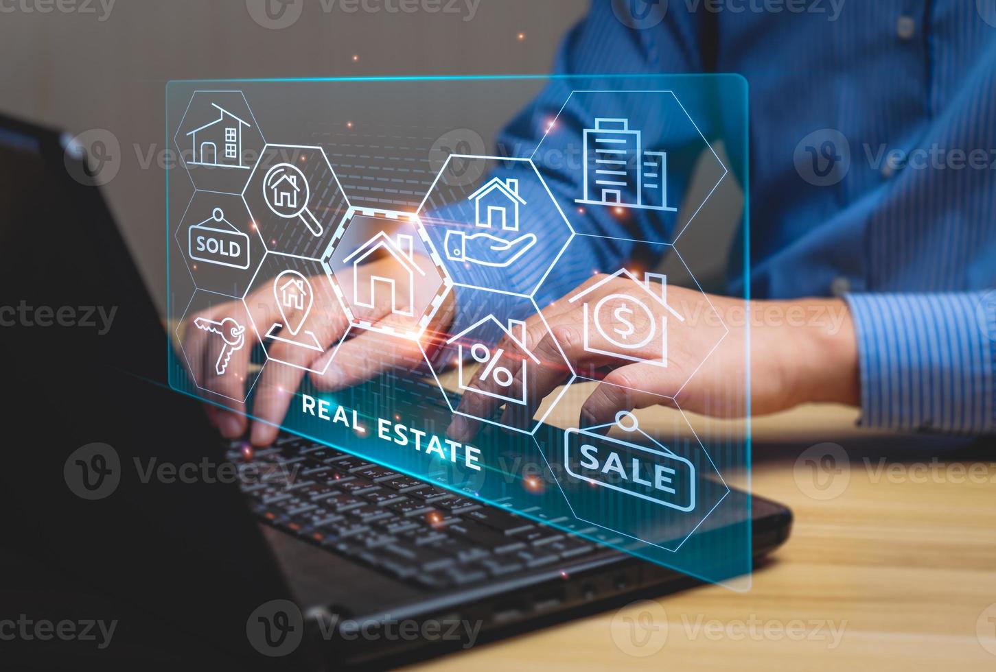 real estate concept, Businessman or home broker with virtual hologram property value on laptop screen. Searching and investing in real estate buy a new home for the family, home search, property tax photo