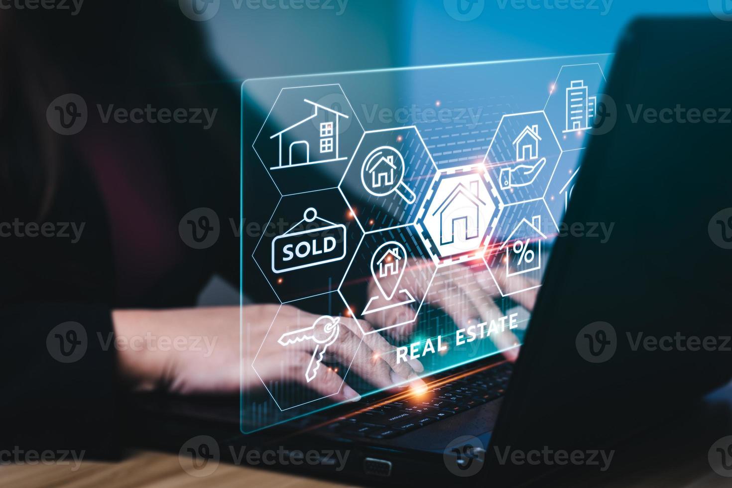 real estate concept, Businessman or home broker with virtual hologram property value on laptop screen. Searching and investing in real estate buy a new home for the family, home search, property tax photo