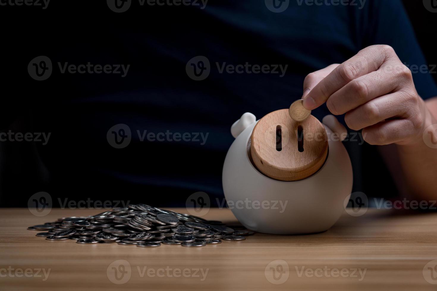 save money concept, businessman keeping money in a piggy bank. financial planning, save money for the future, Savings and pensions photo
