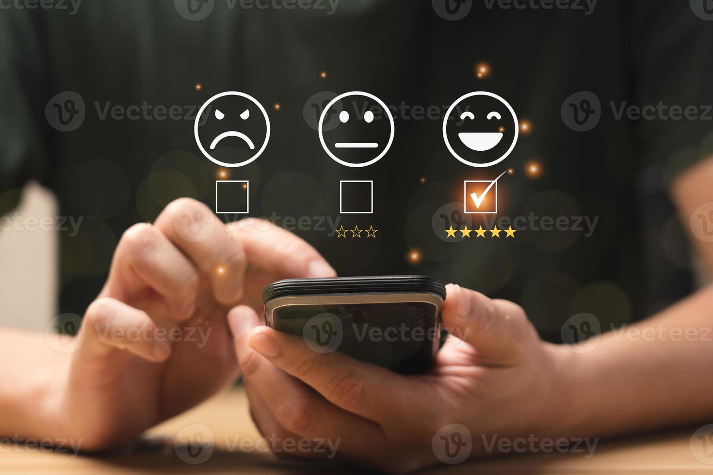 Customer satisfaction concept. Hands of business men using a mobile to comment 5 stars. Satisfaction Rating, good and impressive, after sales service. Excellent business rating, reputation photo