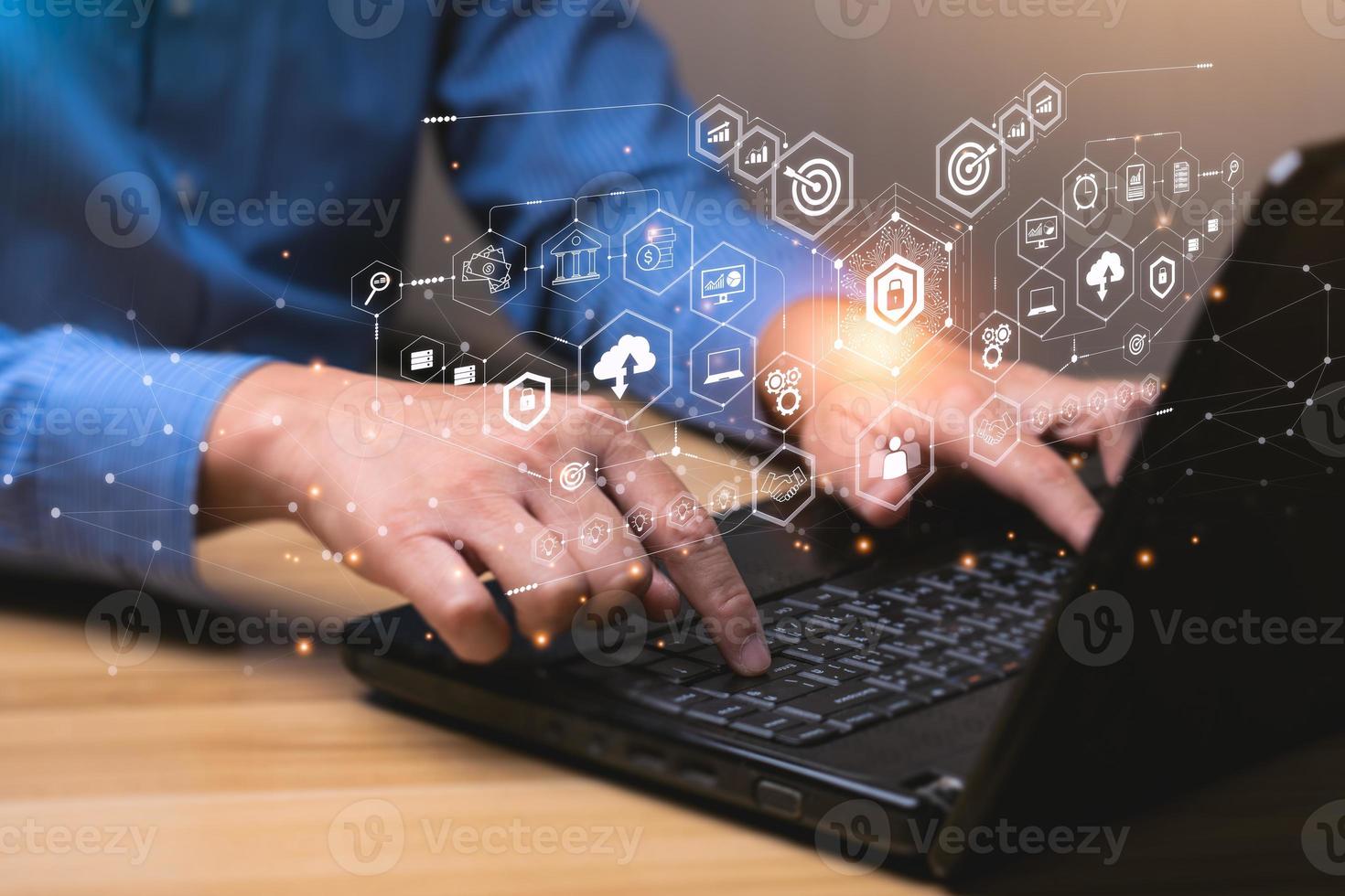 Internet Security and Cyber Network Concepts. Businessman working with laptop computer with padlock icon. data protection and personal information. Hackers' digital crimes photo