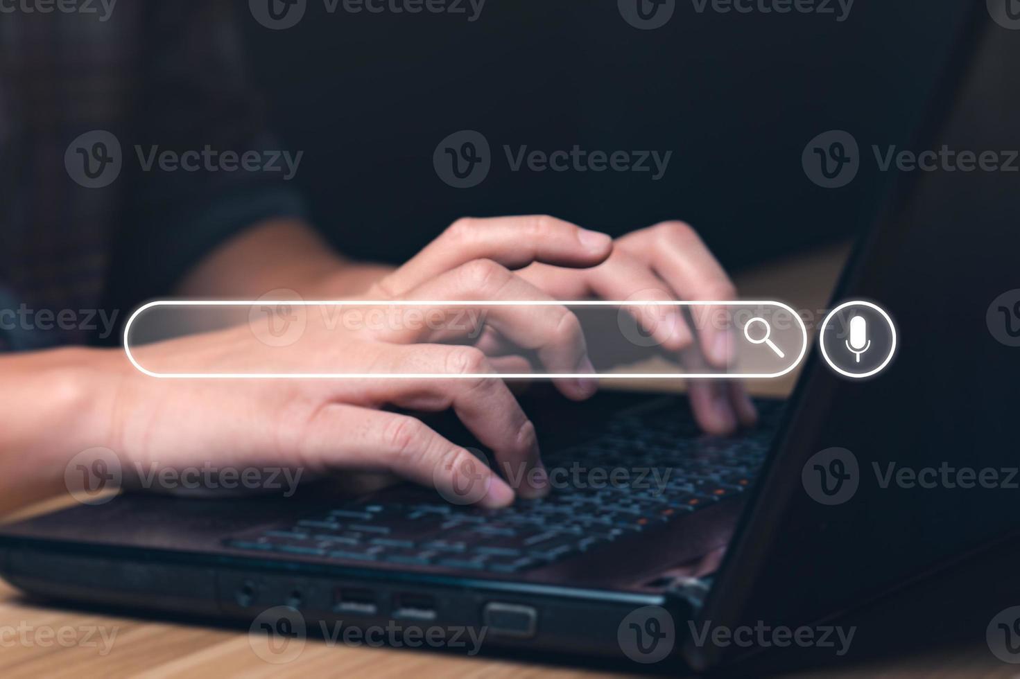 Businessman using laptop to search for information, surfing the Internet network concept information. Businessman hand using laptop to search. Searching Browsing Internet photo