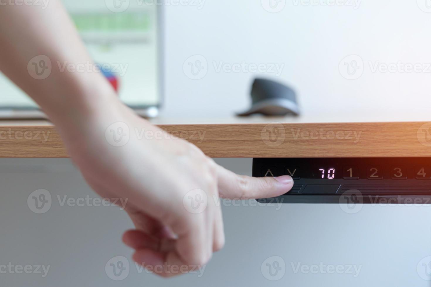 Hand adjustment Ergonomic electric desk or Adjustable height table when working long time for Good posture to avoid Office syndrome, Back Pain, shoulder ache, scapular, fibromyalgia, Neck, piriformis photo