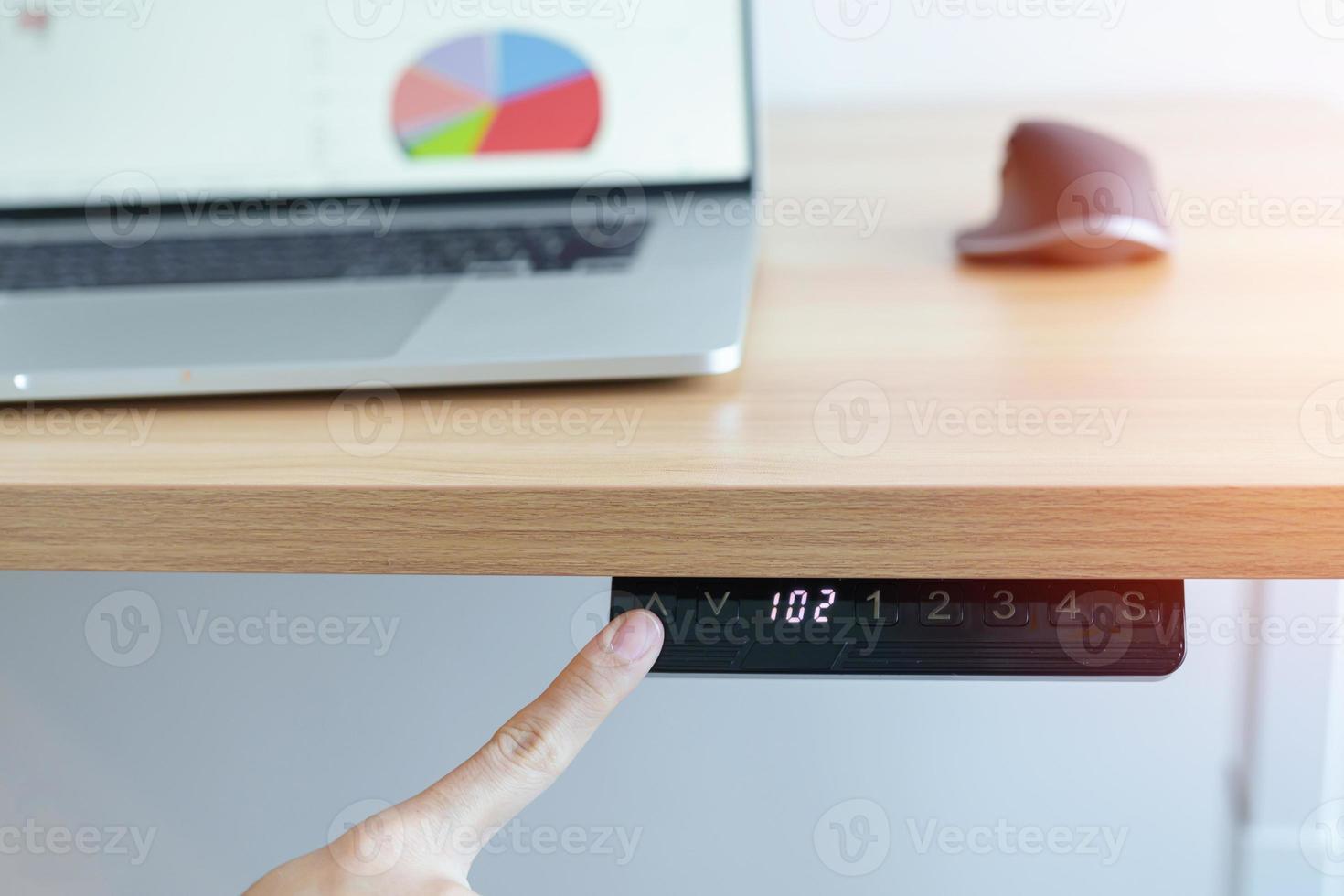 Hand adjustment Ergonomic electric desk or Adjustable height table when working long time for Good posture to avoid Office syndrome, Back Pain, shoulder ache, scapular, fibromyalgia, Neck, piriformis photo