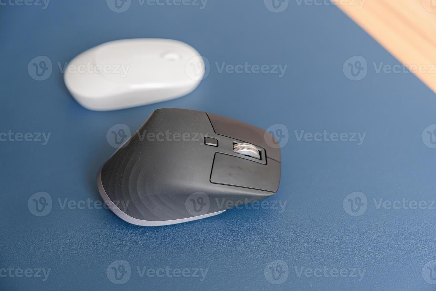Comparison of Ergonomic vertical mouse and general mouse on desk at workplace, prevention wrist pain. De Quervain s tenosynovitis, Intersection Symptom, Carpal Tunnel or Office syndrome concept photo