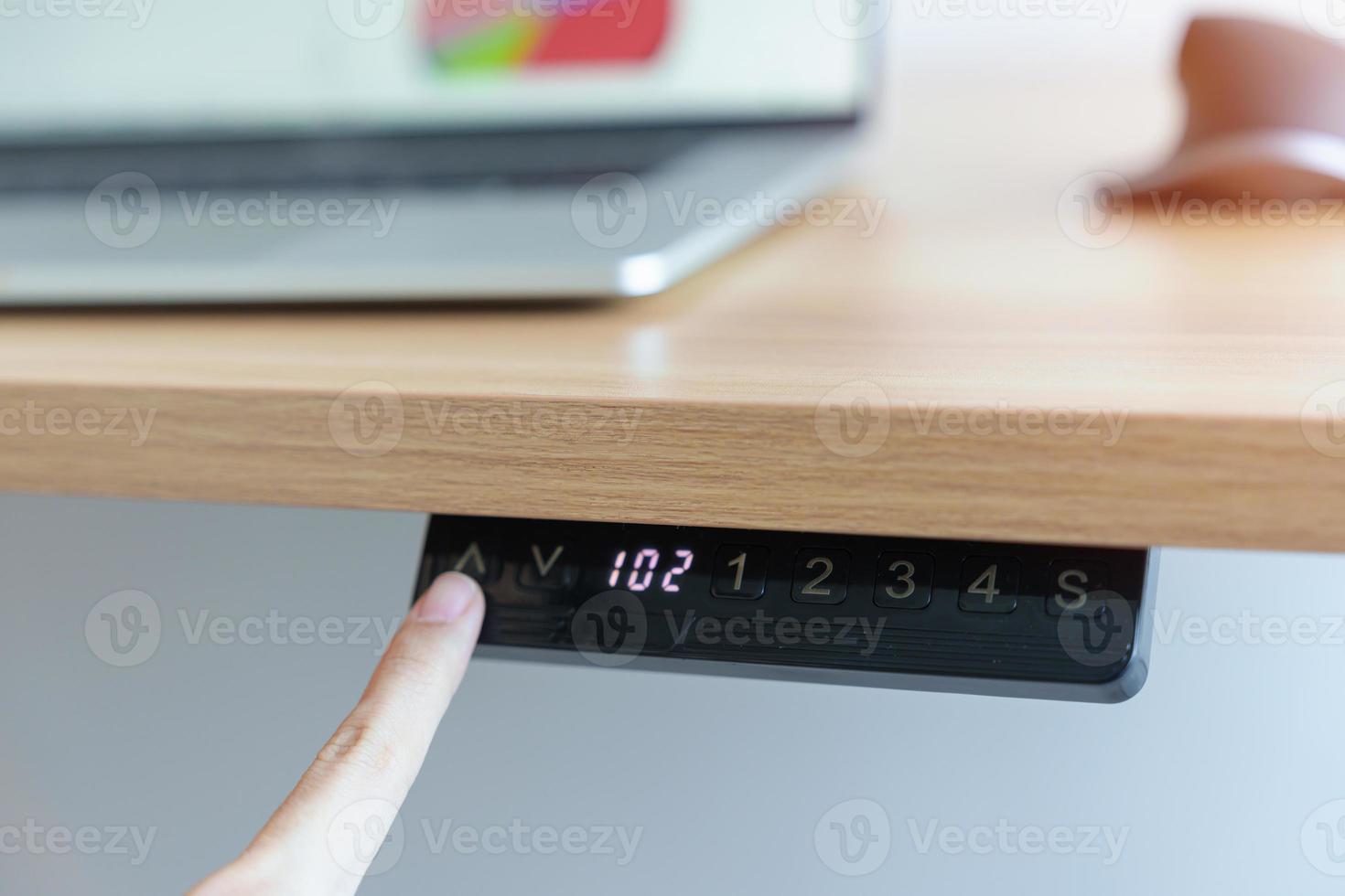 Hand adjustment Ergonomic electric desk or Adjustable height table when working long time for Good posture to avoid Office syndrome, Back Pain, shoulder ache, scapular, fibromyalgia, Neck, piriformis photo