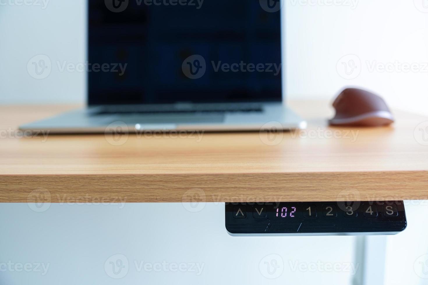 Ergonomic electric desk or Adjustable height table when working long time for Good posture to avoid Office syndrome, Back Pain, shoulder ache, scapular, fibromyalgia, Neck, piriformis photo