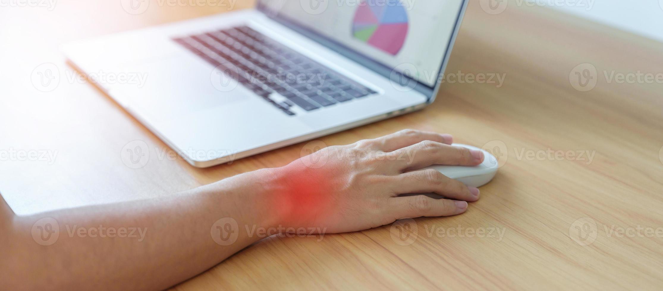 Woman having wrist pain when using mouse during working long time on workplace. De Quervain s tenosynovitis, Intersection Symptom, Carpal Tunnel Syndrome or Office syndrome concept photo