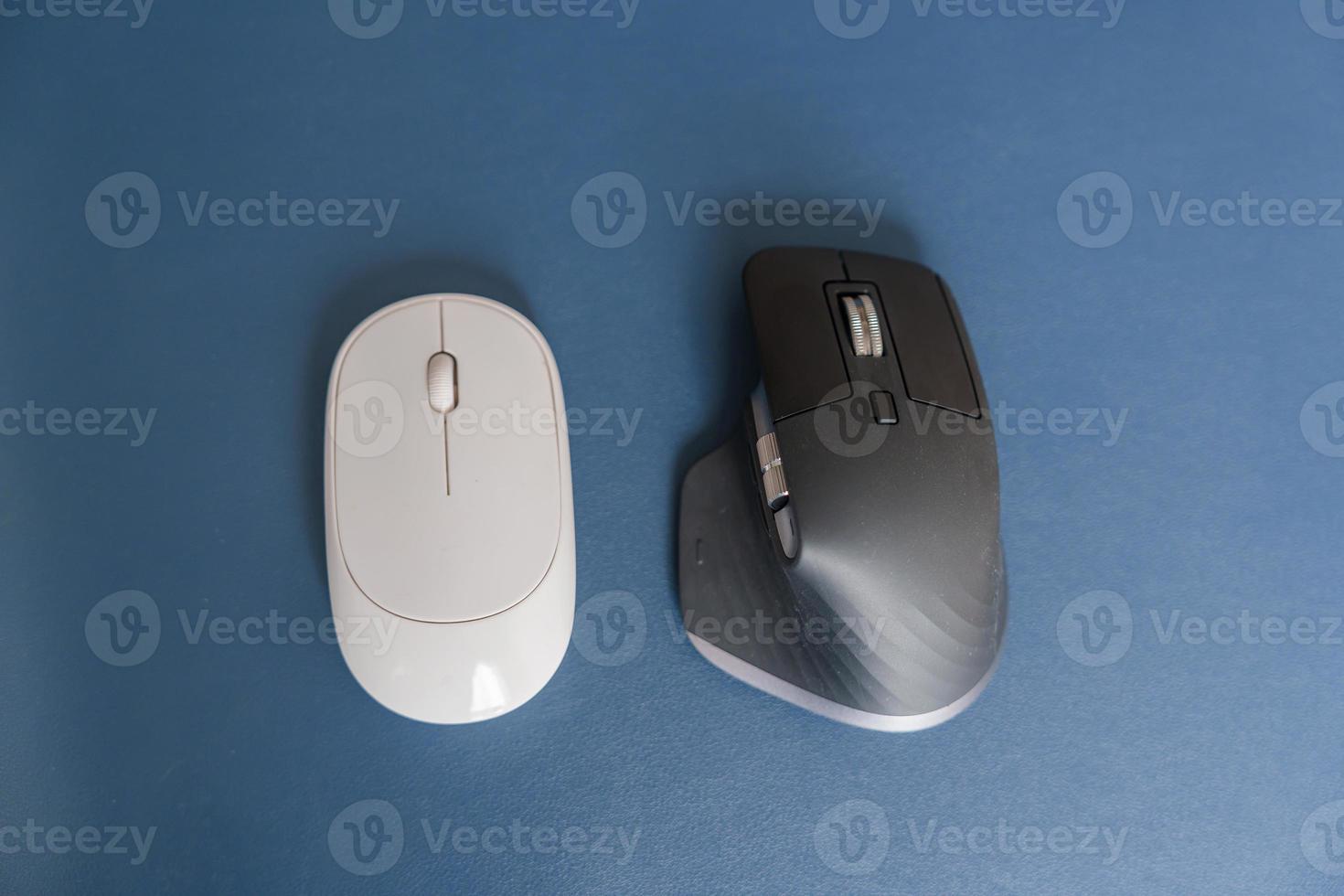 Comparison of Ergonomic vertical mouse and general mouse on desk at workplace, prevention wrist pain. De Quervain s tenosynovitis, Intersection Symptom, Carpal Tunnel or Office syndrome concept photo