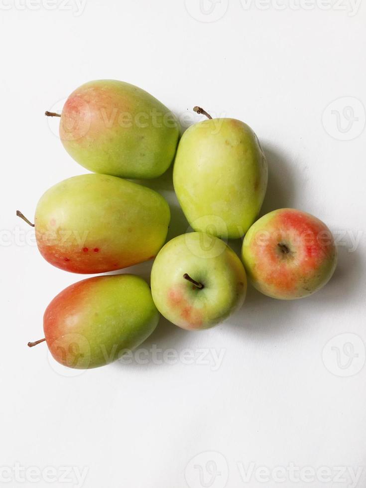 apples of an elongated shape on a white background. kandil sinap apple photo