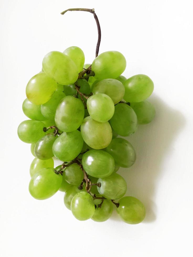 bunch of fresh green grapes isolated on white background photo