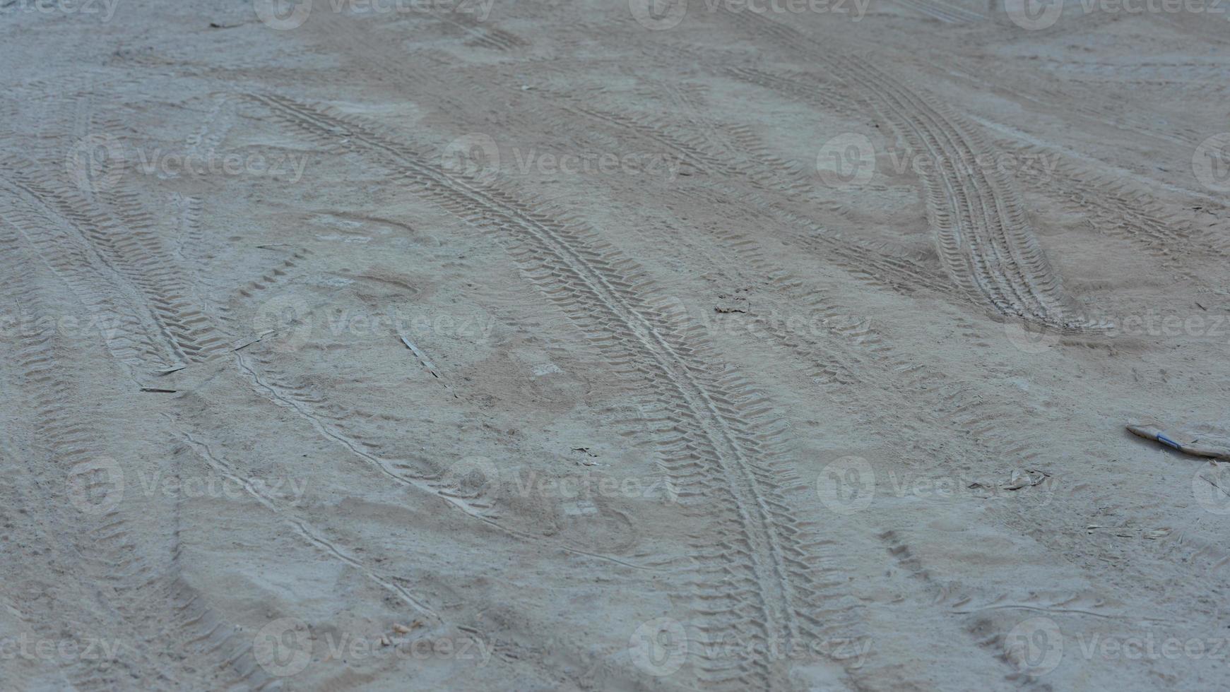 The car tyre print on the muddy road photo