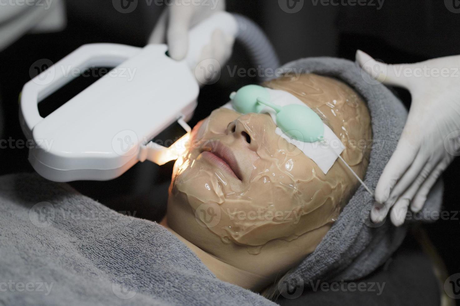 Young women use services in beauty clinics. photo