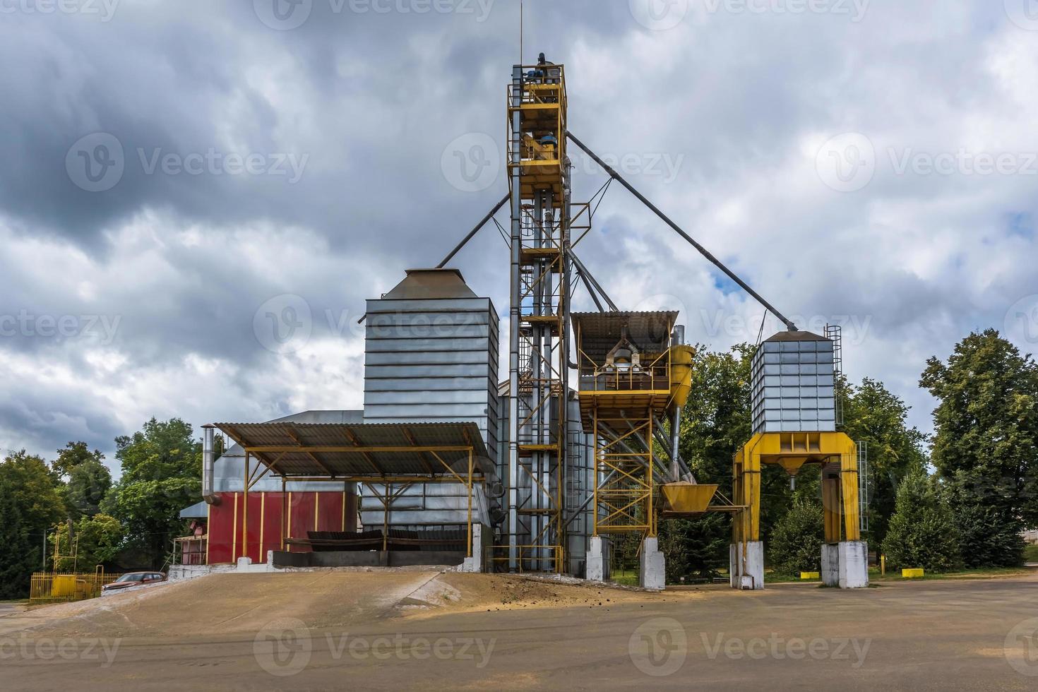 agro silos granary elevator with seeds cleaning line on agro-processing manufacturing plant for processing drying cleaning and storage of agricultural products photo