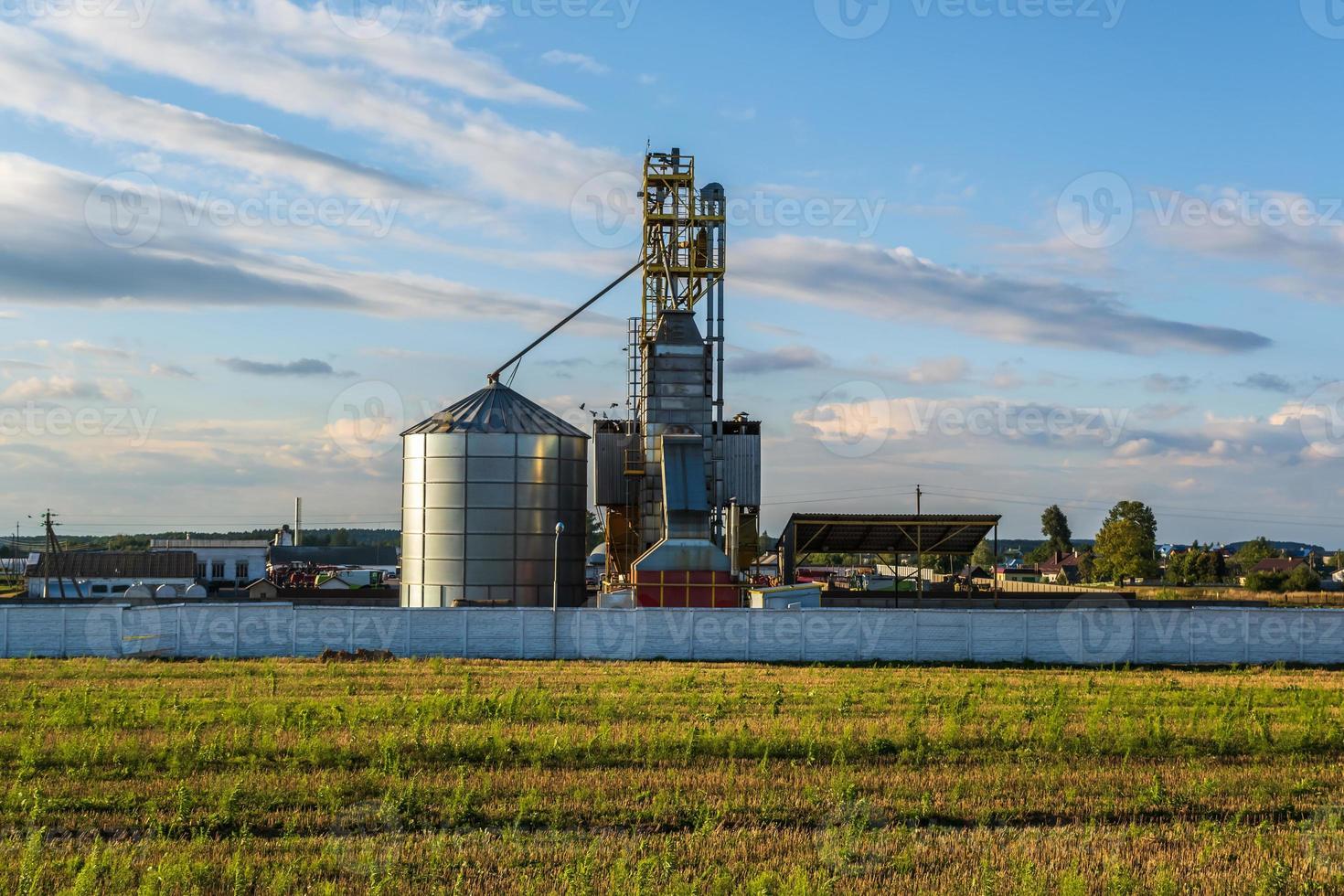 agro silos granary elevator with seeds cleaning line on agro-processing manufacturing plant for processing drying cleaning and storage of agricultural products photo