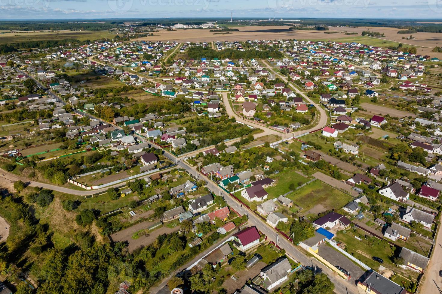 panoramic aerial view of private development with country houses or village photo